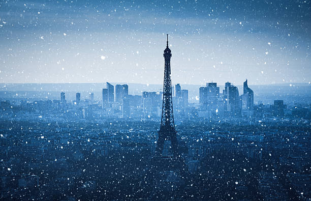 Panoramic view on Eiffel Tower on a snowy winter evening (Paris, France).